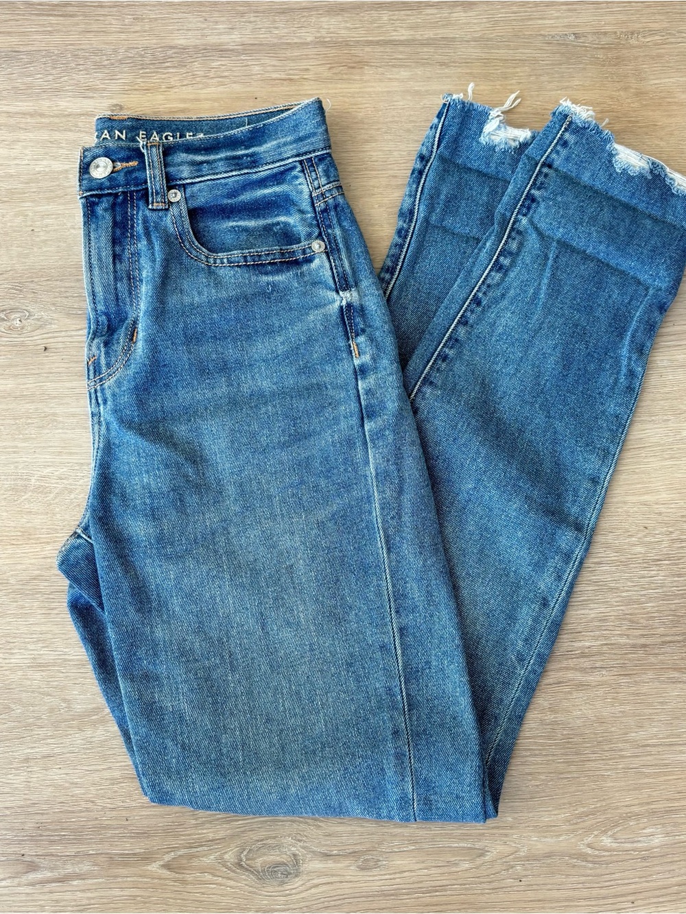 American Eagle Outfitters High-Rise Distressed Hem Blue Jeans